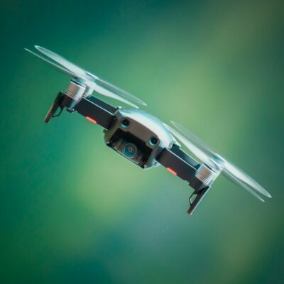 Forward facing drone with a blurred green background