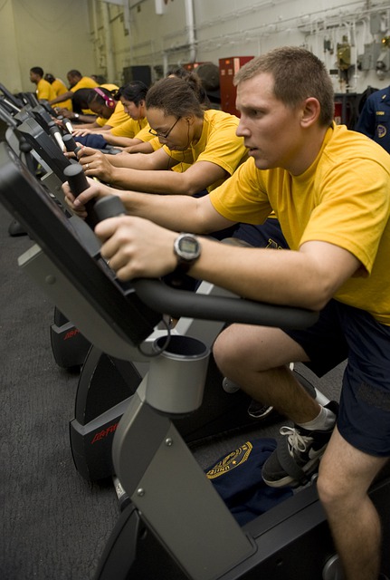 Athletes in the gym on stationary bikes