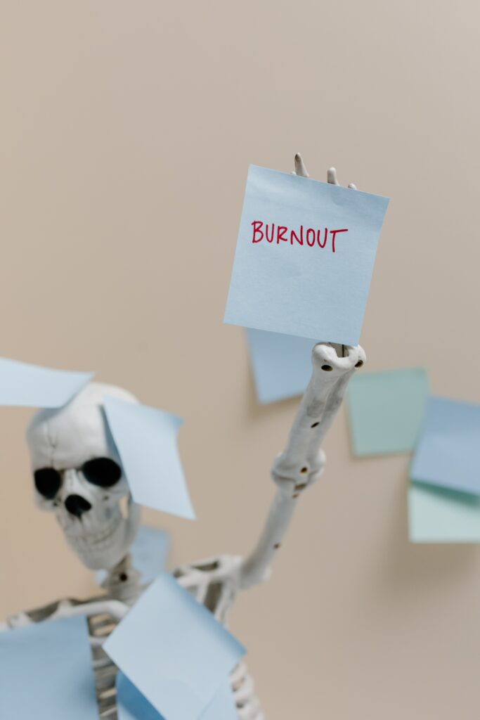 Skeleton covered in post-it notes with burnout written on them